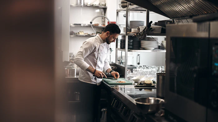 Chef preparing food in a restaurant kitchen